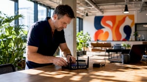 IT technician inspecting network equipment