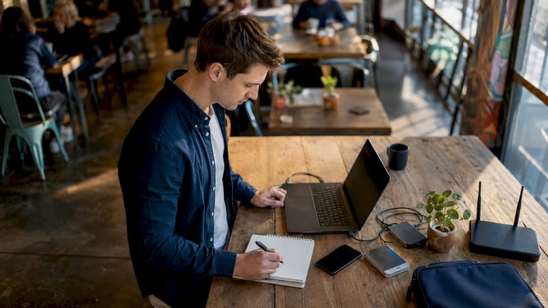 IT support technician working at desk in SMB office