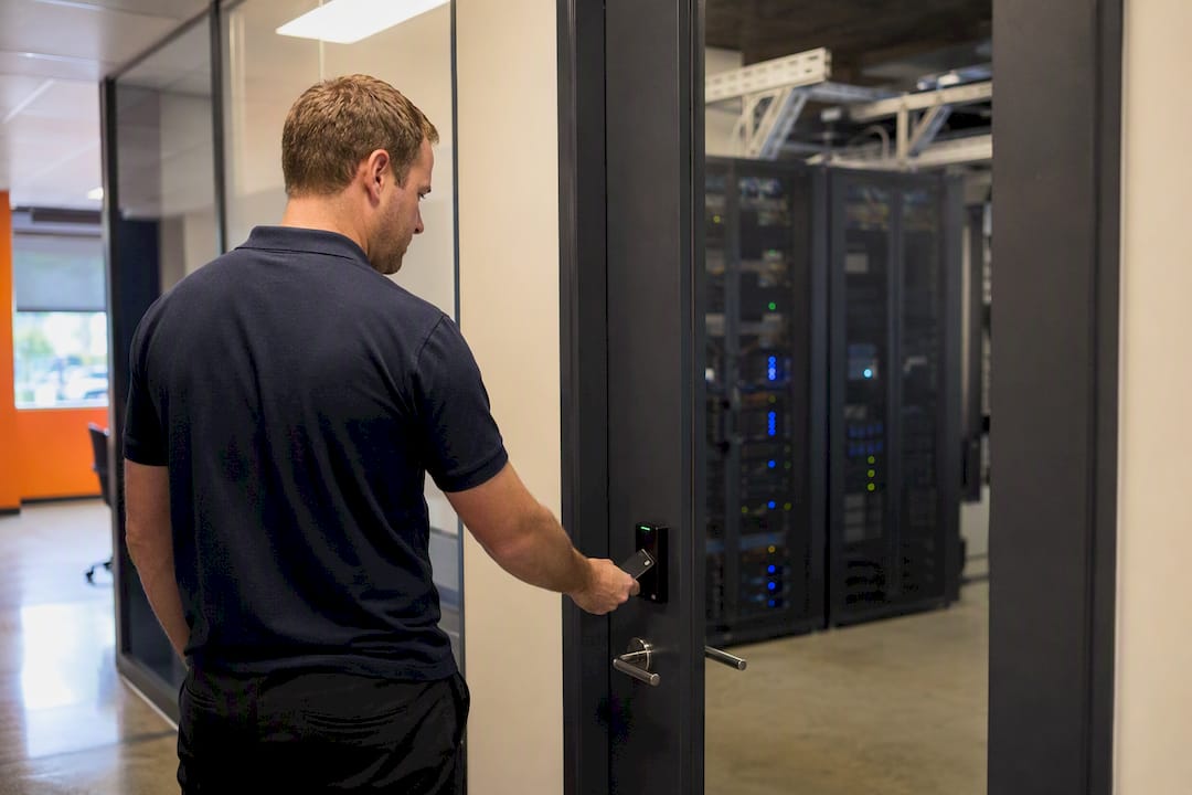 Hand locking server room door with badge