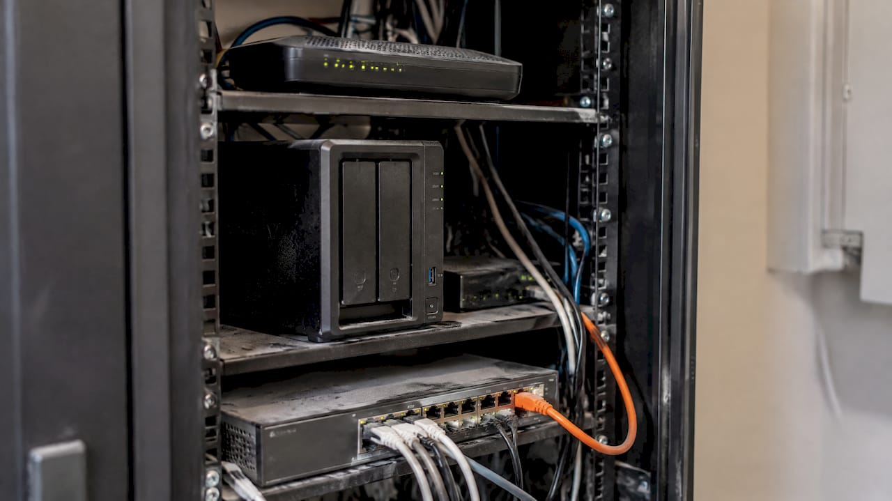 Router, NAS and firewall in an office cupboard
