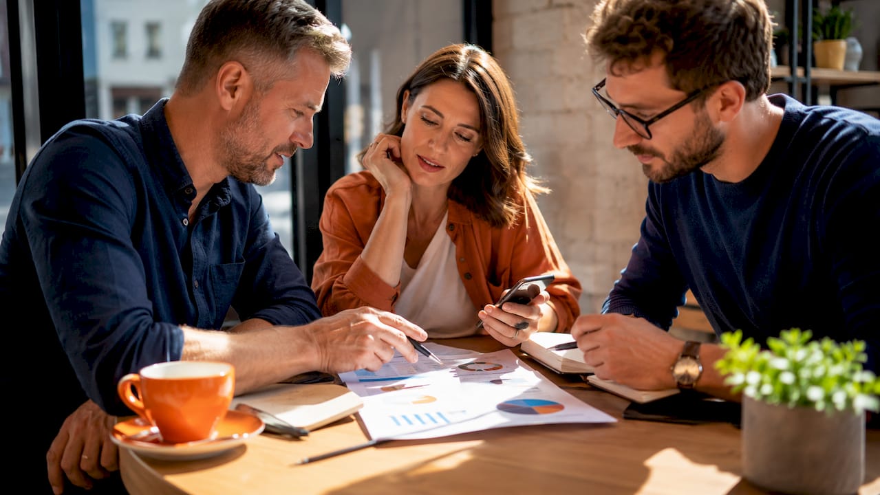 Small business team analyzing cybersecurity vulnerabilities