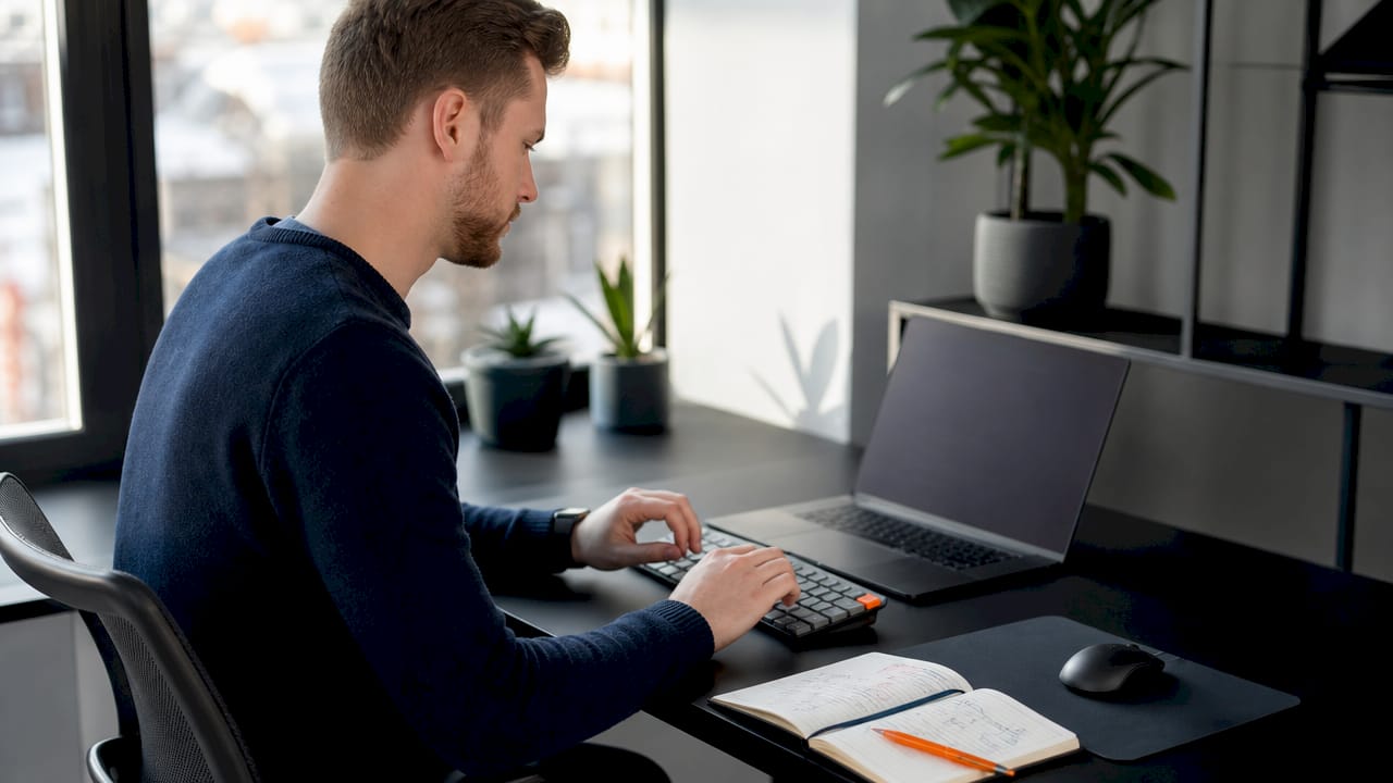 Close-up hands typing on keyboard for cybersecurity